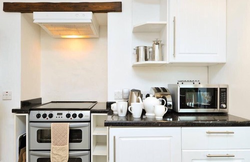 Staveley Cottage | A RIVER RUNS BY, with a garden in Staveley