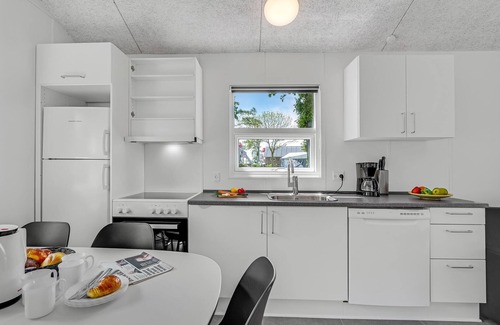 Assens House | A small cottage awaits you here, located on a campsite with a playground.