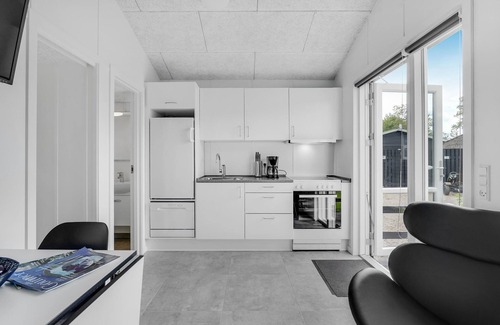 Assens House | A small cottage awaits you here, located on a campsite with a playground.