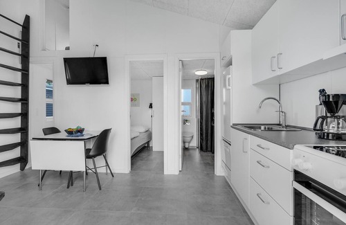 Assens House | A small cottage awaits you here, located on a campsite with a playground.