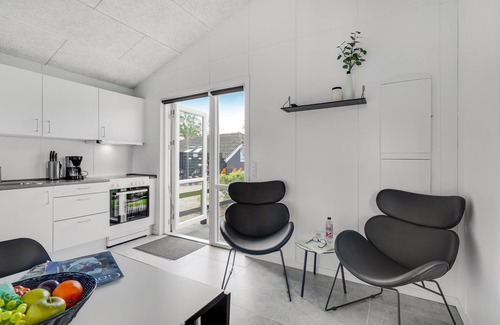 Assens House | A small cottage awaits you here, located on a campsite with a playground.