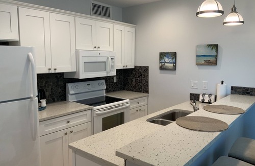Wheeland Settlement Condo | A TRUE OCEAN FRONT view from couch & kitchen ground floor 2 patios quiet corner