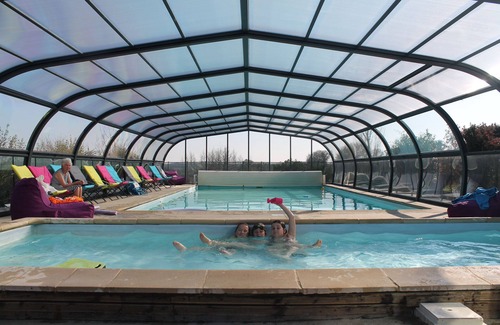 Henansal Cabin | A two bedroom luxury lodge with extra cabin beds, heated covered pool