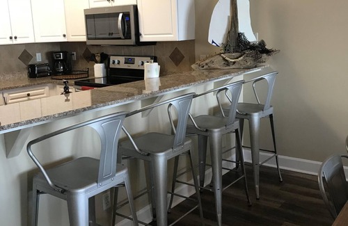 Long Beach Condo | A walk in tiled shower in the master! Huge balcony!