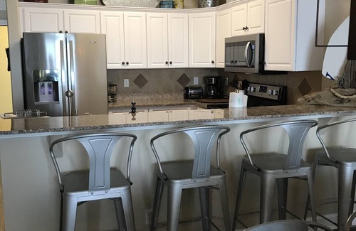 Long Beach Condo | A walk in tiled shower in the master! Huge balcony!