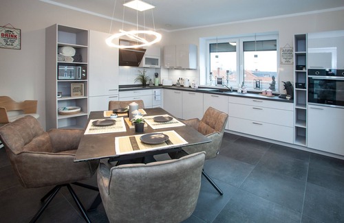 Grasberg Apartment | Above the Rooftops of Grasberg's City