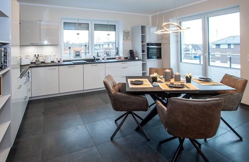 Grasberg Apartment | Above the Rooftops of Grasberg's City