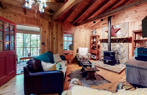 Cashes Valley Cabin | Adorable cabin w/ a private hot tub, screened porch, firepit, & forest views
