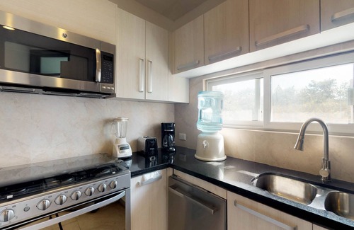 Playa del Carmen Apartment | Air-conditioned condo with strong WiFi, pool, river pool & tropical gardens