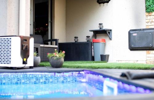 Ekurhuleni Apartment | Air-Conditioned, Self-Catering Apartment with Heated Pool Near OR Tambo International Airport