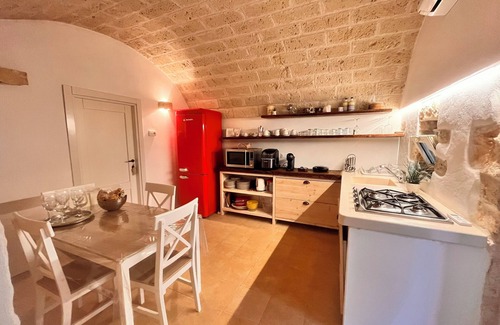 Ostuni Villa | "Al Guappo D'oro," trullo with pool nestled in the Apulian countryside.