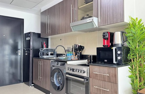 Abu Dhabi Apartment | Al Reef Peaceful Studio: King Bed Comfort for 2