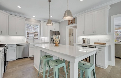 Saint Simons Island House | Amazing Island Oasis, Heated Pool, Outdoor Bar Area with TV, Bocce Ball Court & Putting Green
