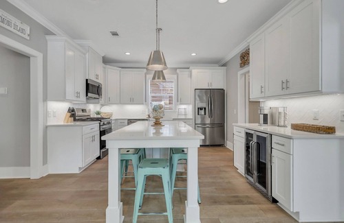 Saint Simons Island House | Amazing Island Oasis, Heated Pool, Outdoor Bar Area with TV, Bocce Ball Court & Putting Green