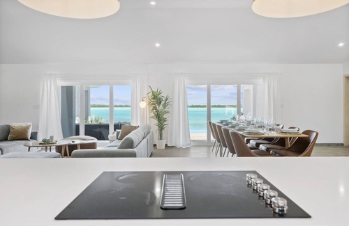 Hartswell Villa | Amazing luxury beach villas with private dock for 20 people! Large heated pools