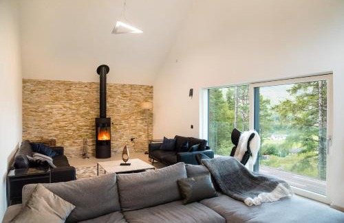 Crianlarich Ski Chalet | An Caisteal Lodge with cascading waterfall view