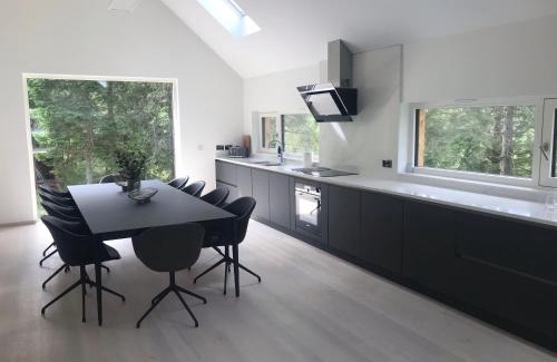 Crianlarich Ski Chalet | An Caisteal Lodge with cascading waterfall view
