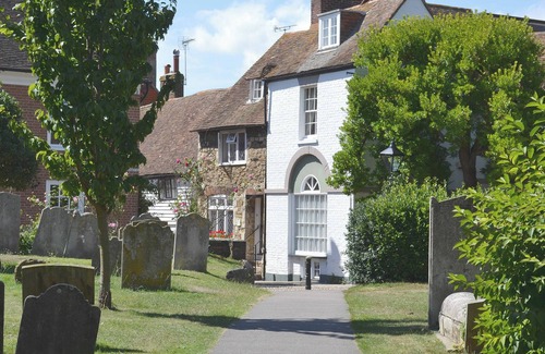 Rye Cottage | An unusual two-storey apartment with beams and an open fire.