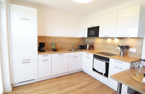 Tossens Apartment | Ankerhuus - enjoy nature on the dyke. Sauna. Fireplace. Terrace.