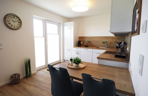 Tossens Apartment | Ankerhuus - enjoy nature on the dyke. Sauna. Fireplace. Terrace.