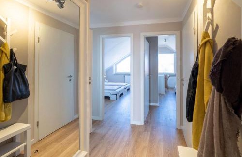 Spiekeroog Apartment | Antares Spiekerooger Gästehaus-Penthouse mit Blick aufs Wattenmeer - Wohnung 9