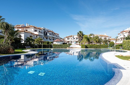 Poblado de Sancti Petri Apartment | Apartment with excellent views of swimming pools and gardens near La Barrosa