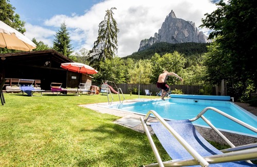 Siusi Apartment | Apartment "Bergfrieden 2 A" with Mountain View, Pool, Wi-Fi, Terrace & Garden