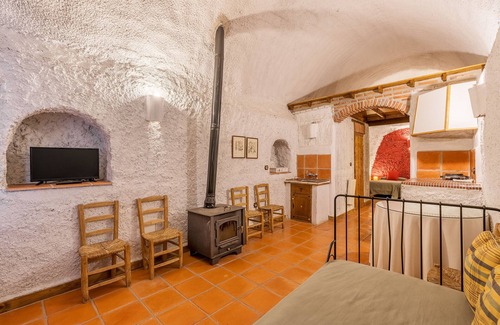 Guadix Apartment | Apartment 'Cueva Karmen' with Mountain View, Shared Pool and Wi-Fi