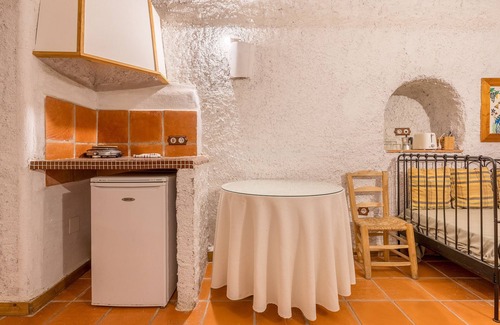 Guadix Apartment | Apartment 'Cueva Karmen' with Mountain View, Shared Pool and Wi-Fi