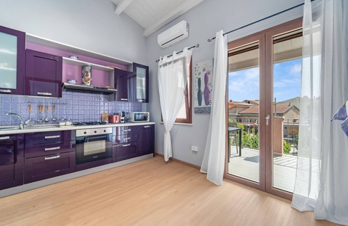 Sant'Antioco Apartment | Apartment 'Di Pina' with Private Terrace, Shared Garden and Air Conditioning