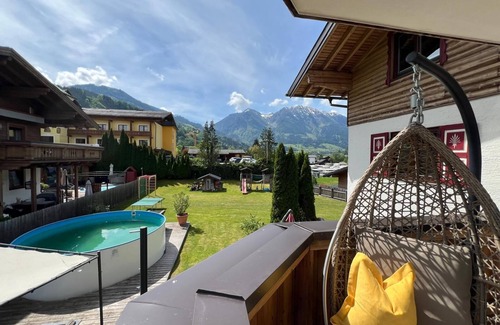 Sankt Johann im Pongau Apartment | Apartment 'Frauenmantel Mit Extra Doppelzimmer' with Mountain View, Shared Pool and Wi-Fi