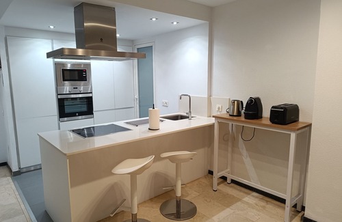 Cala Apartment | Apartment facing the sea. In the center of the Poniente Beach. WIRELESS. Swimming pool