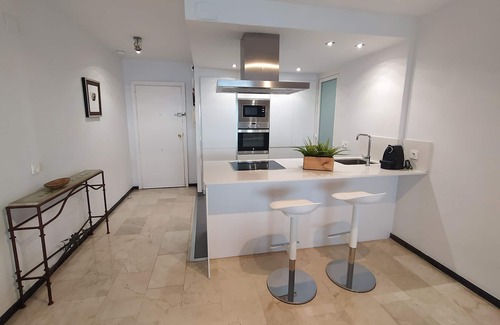 Cala Apartment | Apartment facing the sea. In the center of the Poniente Beach. WIRELESS. Swimming pool