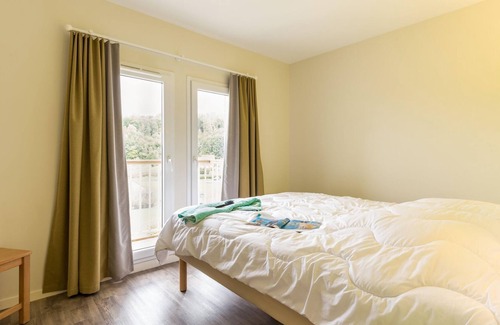 Danestal House | Apartment in Branville with balcony or terrace
