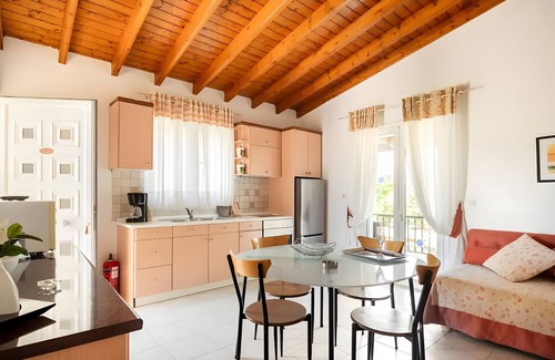Ag. Georgios Apartment | Apartment 'Iris One-Bedroom Bungalow' with Shared Pool, Wi-Fi and Air Conditioning