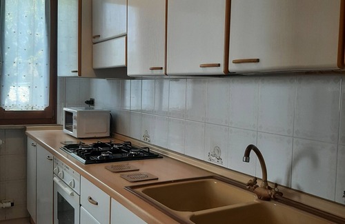 Sandra Apartment | Apartment 'Casa Fiore di Magnolia' with Private Garden, Balcony and Air Conditioning