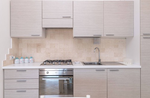 Porto Pozzo Apartment | Apartment 'Il Fiordo 27' with Sea View, Shared Pool and Air Conditioning