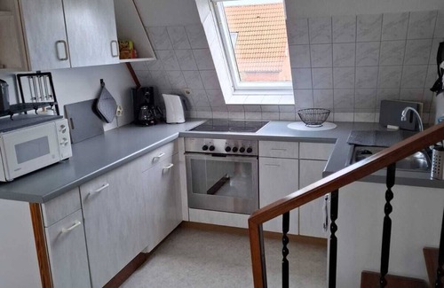 Neßmersiel Apartment | Apartment Lüttje Amselnüst - central location directly on the dike with balcony