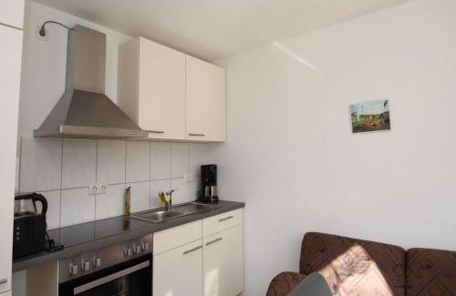 Uttel Apartment | Apartment with a high chair and bed