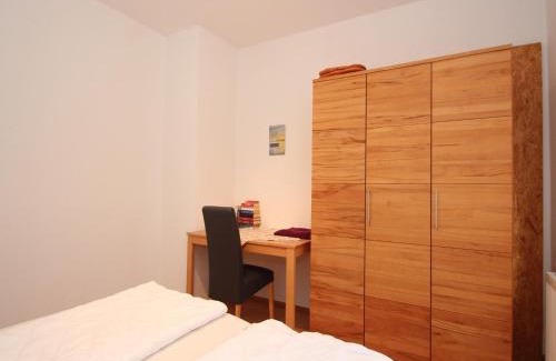 Uttel Apartment | Apartment with a high chair and bed