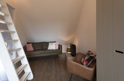 Oostkapelle Apartment | Apartment with balcony on the sunny side, close to nature and beach.