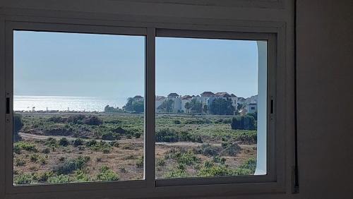 Achakkar Apartment | Appartement avec piscines, vue sur mer et accès à la plage à Achakar Hill, Tanger.