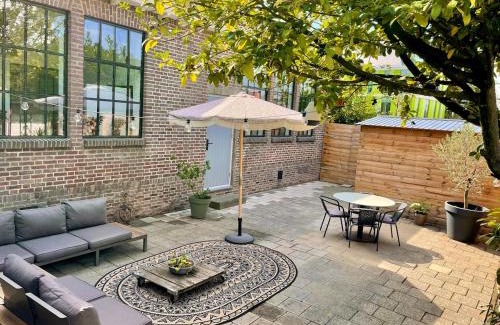 Heerlen Apartment | Appartement het Klaslokaal in de Oude School met tuin