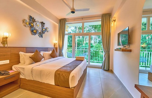 Pallivasal Hotel | Areva Inn Munnar by Voye Homes