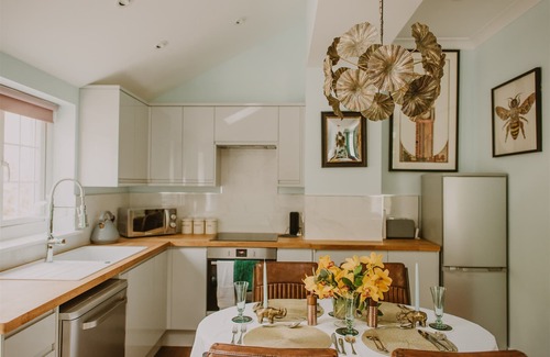 Stranraer Cottage | Artful Retreat: Artemisia Lodge with Vast Garden on Seaside Estate