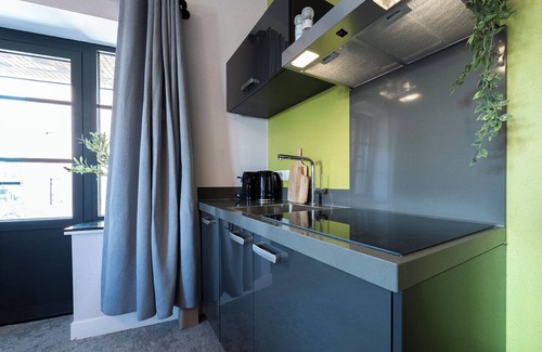 Centrum Apartment | Artist-inspired suite for 2 with king bed, private kitchen, air conditioning, and modern comforts. Perfect for couples, solo travelers, or business stays.