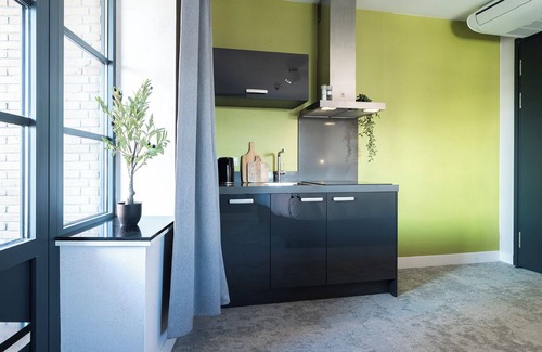Centrum Apartment | Artist-inspired suite for 2 with king bed, private kitchen, air conditioning, and modern comforts. Perfect for couples, solo travelers, or business stays.