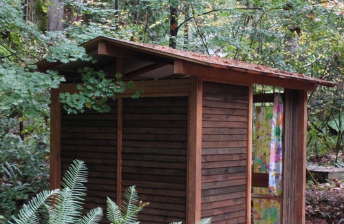 Geneva House | Artists Stone Cabin with Bath House, Sauna & Cedar Soaking Tub in Private Forest