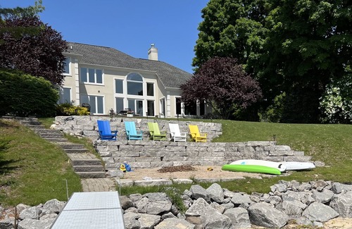 Suttons Bay House | As Seen on HGTV! Luxury Living, Gorgeous Views & Private Beachfront On West Bay
