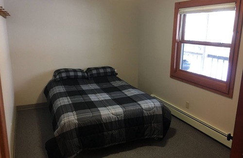 Deerton Cabin | Atv-Snowmobile Trail, sits on the Laughing Whitefish River, sleeps 16 people.